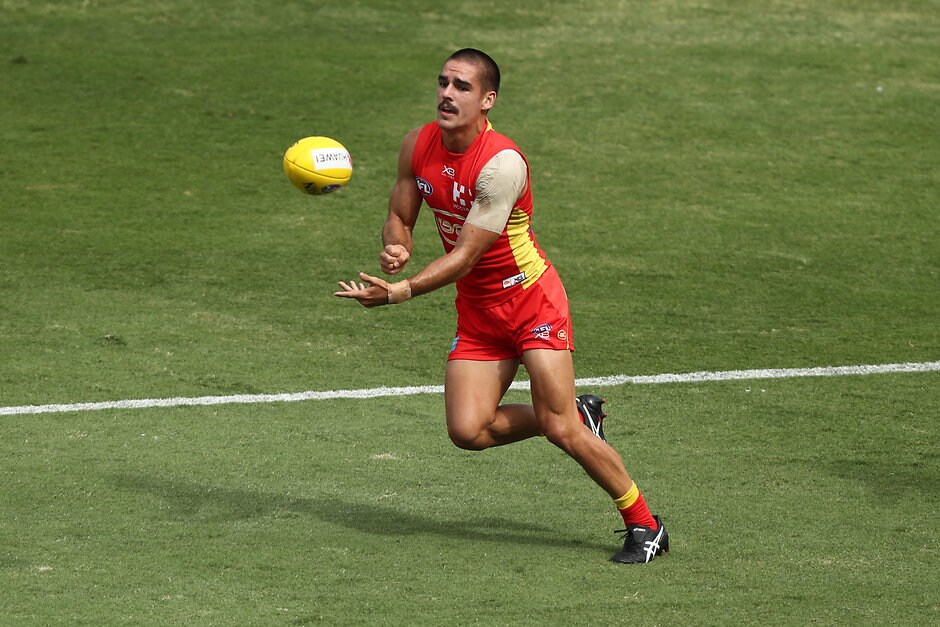 AFL 2019 Training - Gold Coast v Brisbane Practice Match GOLD COAST, AUSTRALIA - FEBRUARY 23: Jacob Dawson of the Suns handballs during the AFL pre-season practice match between the Gold Coast Suns and the Brisbane Lions at Metricon Stadium on February 23, 2019 in Gold Coast, Australia. (Photo by Chris Hyde/Getty Images)