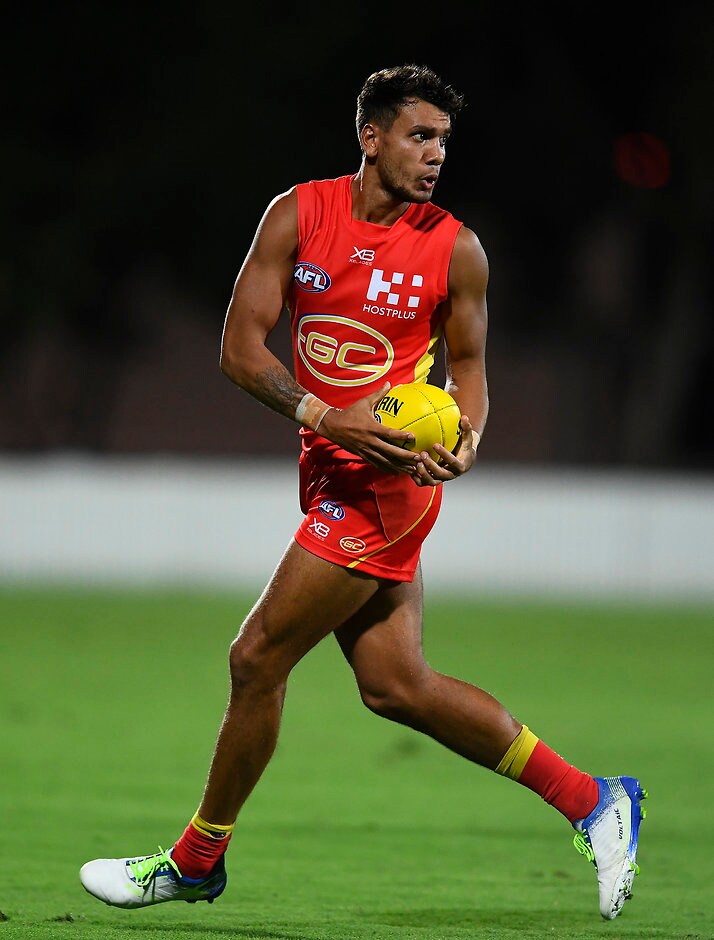 AFL 2019 JLT Community Series - Gold Coast v Western Bulldogs MACKAY, AUSTRALIA - MARCH 03: Callum Ah Chee of the Suns runs the ball during the 2019 JLT Community Series AFL match between the Gold Coast Suns and the Western Bulldogs at Great Barrier Reef Arena on March 03, 2019 in Mackay, Australia. (Photo by Ian Hitchcock/Getty Images)