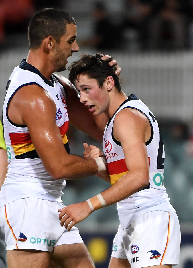 AFL 2019 JLT Community Series - GWS v Adelaide CANBERRA, AUSTRALIA - MARCH 08: Chayce Jones of the Crows celebrates a goal with Taylor Walker of the Crows during the 2019 JLT Community Series AFL match between the Greater Western Sydney Giants and the Adelaide Crows at UNSW Canberra Oval on March 08, 2019 in Canberra, Australia. (Photo by Tracey Nearmy/Getty Images)