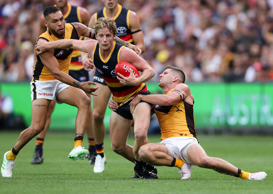 AFL 2019 Round 01 - Adelaide v Hawthorn ADELAIDE, AUSTRALIA - MARCH 23: Rory Sloane of the Crows is tackled by Luke Breust and Jarman Impey of the Hawks during the 2019 AFL round 01 match between the Adelaide Crows and the Hawthorn Hawks at Adelaide Oval on March 23, 2019 in Adelaide, Australia. (Photo by AFL Photos)