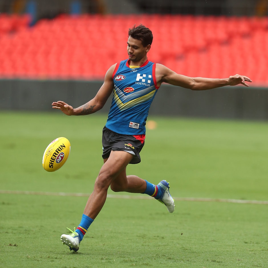 AFL 2019 Training - Gold Coast Suns 270319 GOLD COAST, AUSTRALIA - MARCH 27: Callum Ah Chee kicks during a Gold Coast Suns AFL training session at Metricon Stadium on March 27, 2019 in Gold Coast, Australia. (Photo by Chris Hyde/Getty Images)