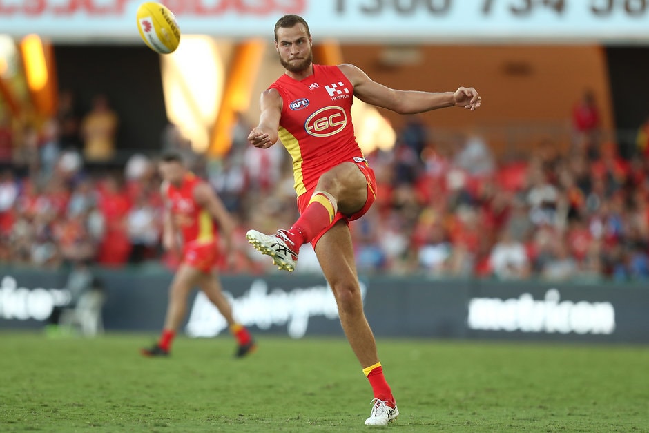AFL 2019 Round 02 - Gold Coast v Fremantle GOLD COAST, AUSTRALIA - MARCH 31: Jarrods Witts of the Suns kicks during the round two AFL match between the Gold Coast Suns and the Fremantle Dockers at Metricon Stadium on March 31, 2019 in Gold Coast, Australia. (Photo by Chris Hyde/Getty Images)