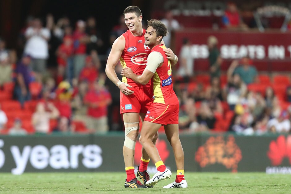 AFL 2019 Round 02 - Gold Coast v Fremantle Suns defenders Sam Collins and Jarrod Harbow (right) - AFL,Gold Coast Suns,Jarrod Harbrow