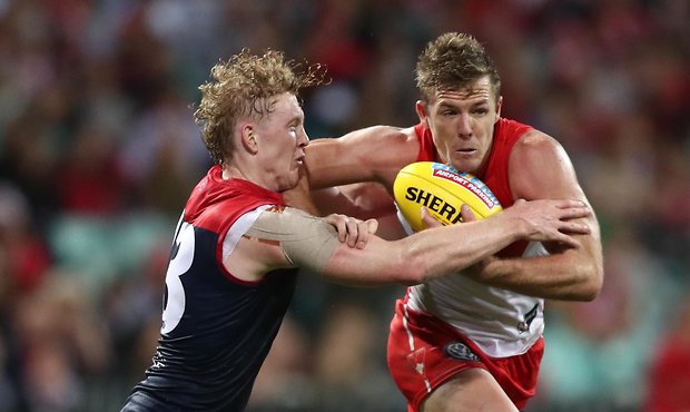 AFL 2019 Round 04 - Sydney v Melbourne SYDNEY, AUSTRALIA - APRIL 11: Luke Parker of the Swans is tackled by Clayton Oliver of the Demons during the round four AFL match between the Sydney Swans and the Melbourne Demons at Sydney Cricket Ground on April 11, 2019 in Sydney, Australia. (Photo by Mark Metcalfe/AFL Photos/Getty Images)