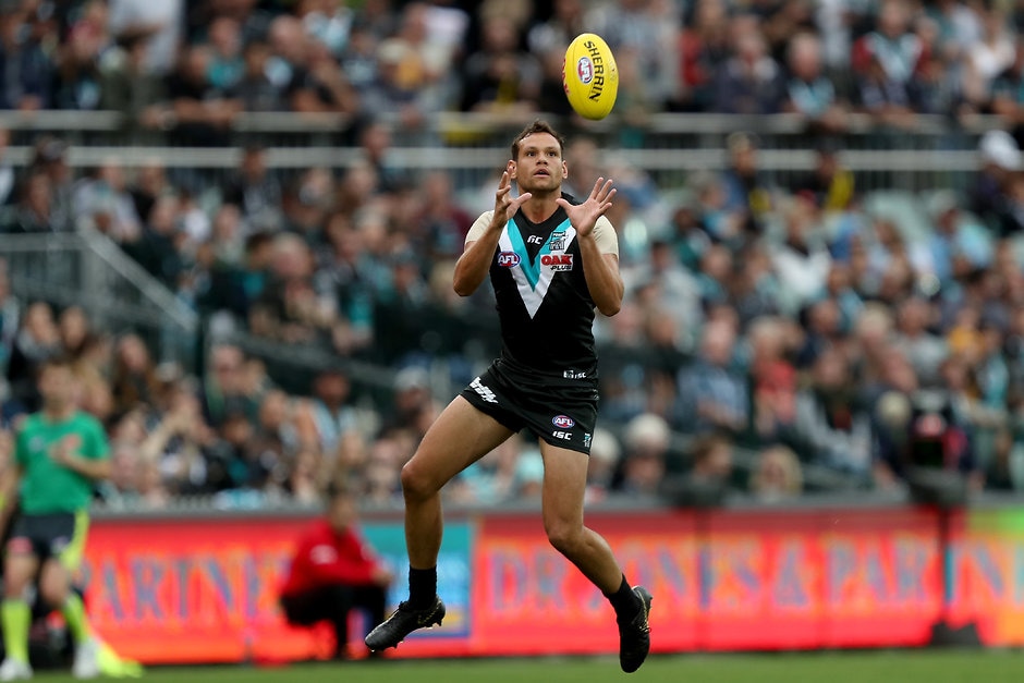 AFL 2019 Round 04 - Port Adelaide v Richmond ADELAIDE, AUSTRALIA - APRIL 13: Steven Motlop of the Power marks the ball during the 2019 AFL round 04 match between the Port Adelaide Power and the Richmond Tigers at Adelaide Oval on April 13, 2019 in Adelaide, Australia. (Photo by James Elsby/AFL Photos)