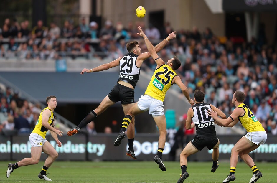AFL 2019 Round 04 - Port Adelaide v Richmond ADELAIDE, AUSTRALIA - APRIL 13: Scott Lycett of the Power and Toby Nankervis of the Tigers compete in a ruck contest during the 2019 AFL round 04 match between the Port Adelaide Power and the Richmond Tigers at Adelaide Oval on April 13, 2019 in Adelaide, Australia. (Photo by AFL Photos)