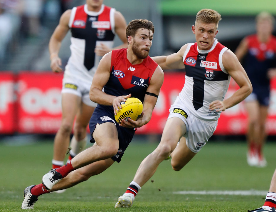 AFL 2019 Round 05 - Melbourne v St Kilda MELBOURNE, AUSTRALIA - APRIL 20: Jack Viney of the Demons is chased by Sebastian Ross of the Saints during the 2019 AFL round 05 match between the Melbourne Demons and the St Kilda Saints at the Melbourne Cricket Ground on April 20, 2019 in Melbourne, Australia. (Photo by Michael Willson/AFL Photos)