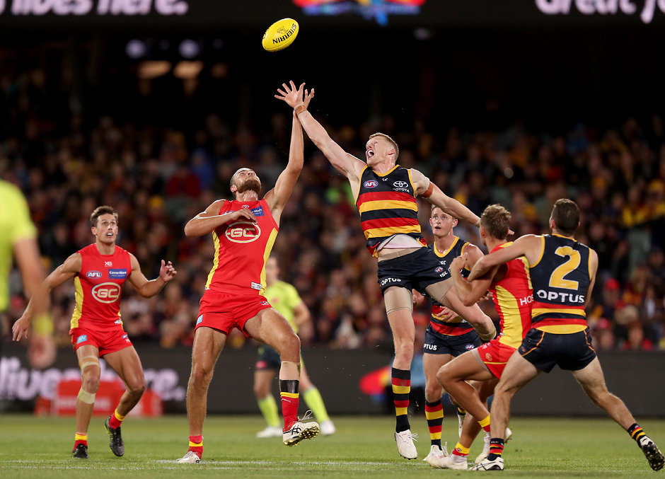 AFL 2019 Round 05 - Adelaide v Gold Coast ADELAIDE, AUSTRALIA - APRIL 21: Reilly O'Brien of the Crows clashes with Jarrod Witts of the Suns during the 2019 AFL round 05 match between the Adelaide Crows and the Gold Coast Suns at the Adelaide Oval on April 21, 2019 in Melbourne, Australia. (Photo by James Elsby/AFL Photos)