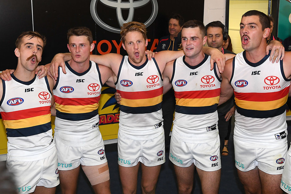 AFL 2019 Round 06 - St Kilda v Adelaide MELBOURNE, AUSTRALIA - APRIL 27: Jordan Gallucci, Matt Crouch, Rory Sloane, Brad Crouch and Taylor Walker of the Crows sing the song in the rooms after winning the round 6 AFL match between St Kilda and Adelaide at Marvel Stadium on April 27, 2019 in Melbourne, Australia. (Photo by Quinn Rooney/Getty Images)