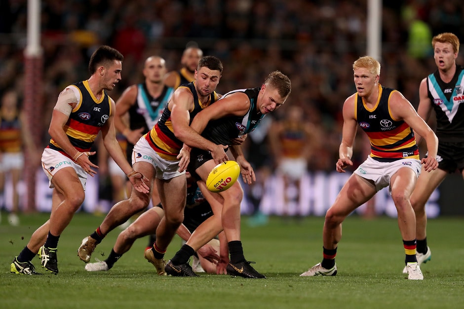 AFL 2019 Round 08 - Port Adelaide v Adelaide ADELAIDE, AUSTRALIA - MAY 11: Rory Atkins of the Crows tackles Dan Houston of the Power during the 2019 AFL round 08 match between the Port Adelaide Power and the Adelaide Crows at Adelaide Oval on May 11, 2019 in Adelaide, Australia. (Photo by James Elsby/AFL Photos)