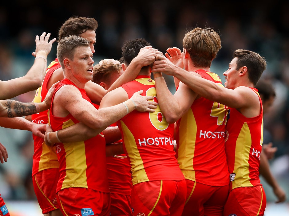 AFL 2019 Round 09 - Port Adelaide v Gold Coast ADELAIDE, AUSTRALIA - MAY 19: Brayden Fiorini of the Suns celebrates a goal with team mates during the 2019 AFL round 09 match between the Port Adelaide Power and the Gold Coast Suns at Adelaide Oval on May 19, 2019 in Adelaide, Australia. (Photo by Matt Turner/AFL Photos)