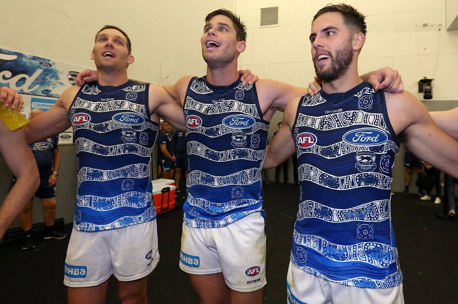 AFL 2019 Round 10 - Gold Coast v Geelong Harry Taylor, Tom Hawkins and James Parsons celebrate the win in the rooms. - Geelong Cats,Tim Kelly,Tom Hawkins