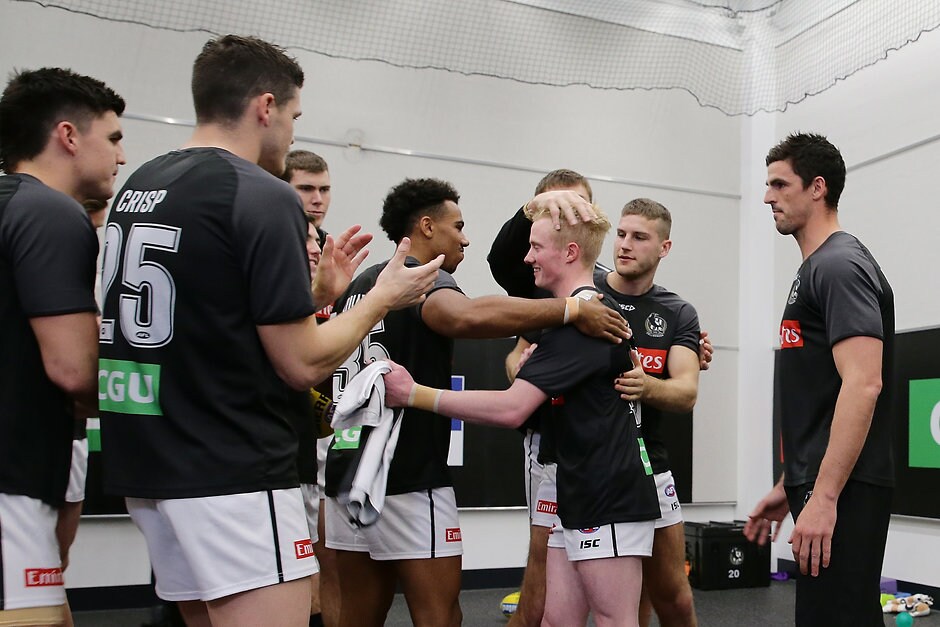 AFL 2019 Round 17 - West Coast v Collingwood John Noble is congratulated after receiving his first AFL jumper - Collingwood Magpies