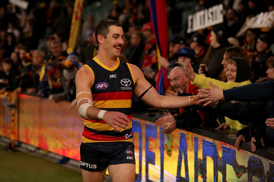 AFL 2019 Round 20 - Adelaide v St Kilda ADELAIDE, AUSTRALIA - AUGUST 03: Taylor Walker of the Crows celebrates their win during the 2019 AFL round 20 match between the Adelaide Crows and the St Kilda Saints at the Adelaide Oval on August 03, 2019 in Adelaide, Australia. (Photo by James Elsby/AFL Photos)