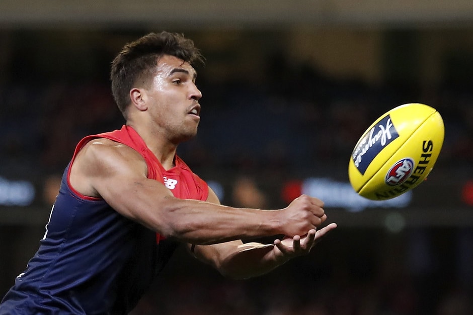 AFL 2019 Round 22 - Melbourne v Sydney MELBOURNE, AUSTRALIA - AUGUST 16: Jay Kennedy Harris of the Demons handpasses the ball during the 2019 AFL round 22 match between the Melbourne Demons and the Sydney Swans at the Melbourne Cricket Ground on August 16, 2019 in Melbourne, Australia. (Photo by Dylan Burns/AFL Photos)